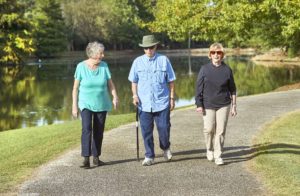 Three senior residents taking a walk